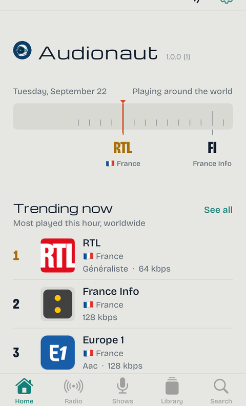 Audionaut's Home screen: the tuning dial, trending stations worldwide, and a Favorites shelf